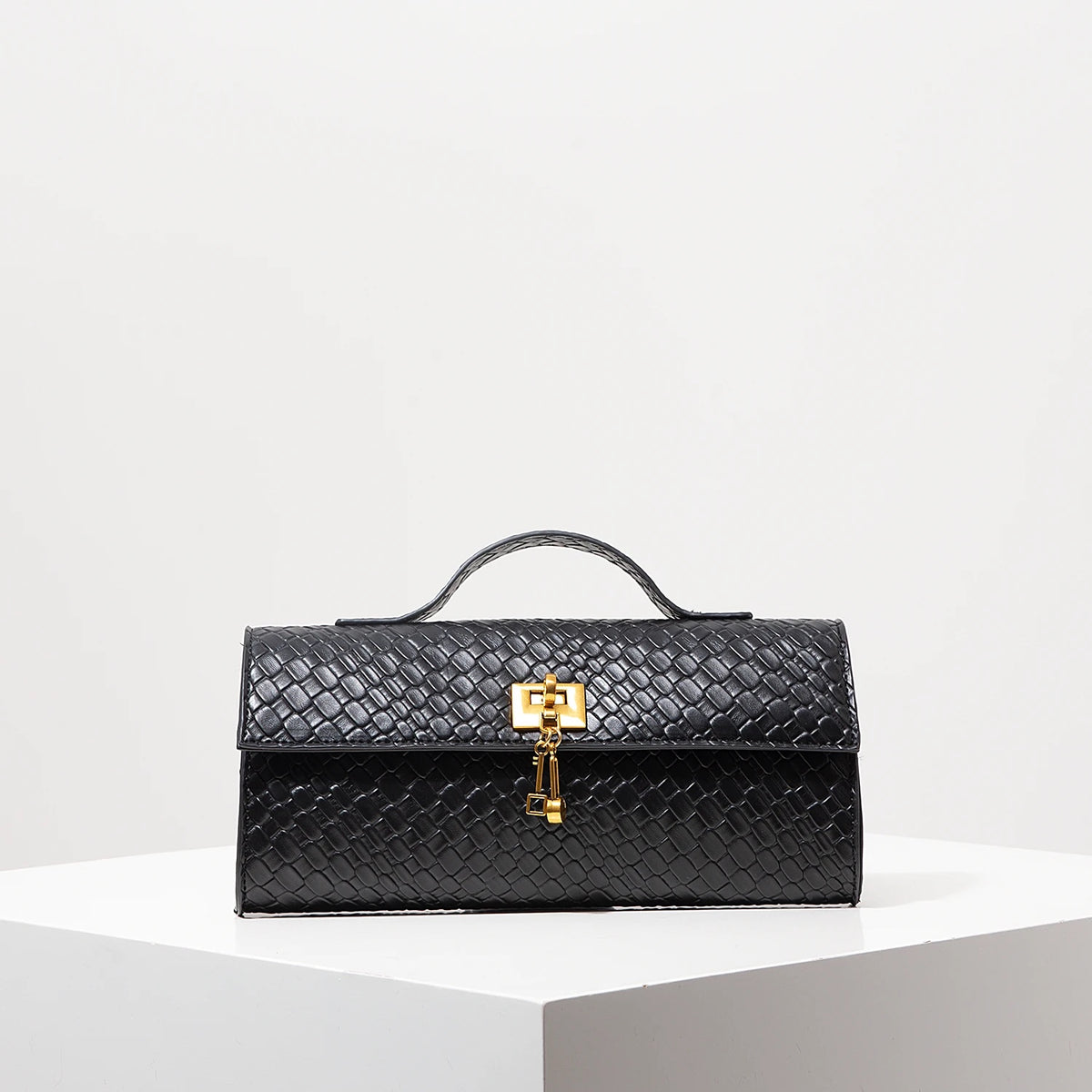Geometric Baguette Clasp Bag — black